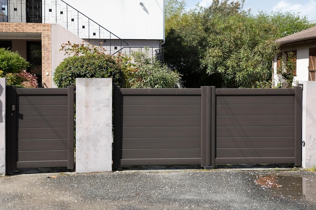 Aluminium door modern home brown dark steel gate and portal of suburb house