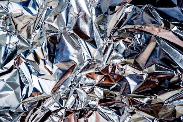 Aluminium foil crumpled Silver texture abstract background