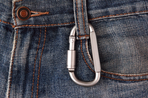 Aluminum carabiner hanging on jeans