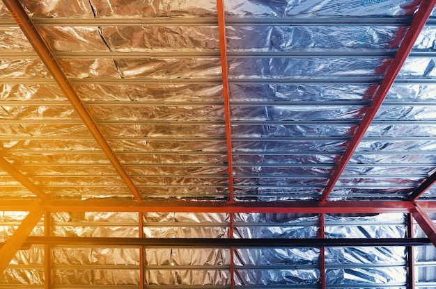 Photo aluminum foil tin ceiling under house roof with high temperature overheat effect