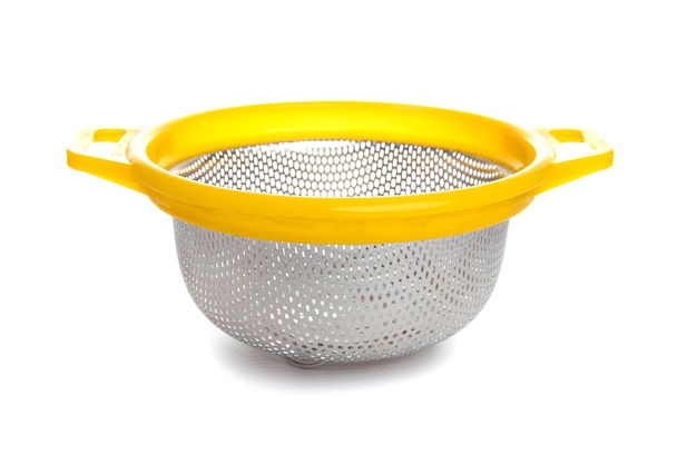 Photo aluminum kitchen colander with plastic yellow handle isolated on white background