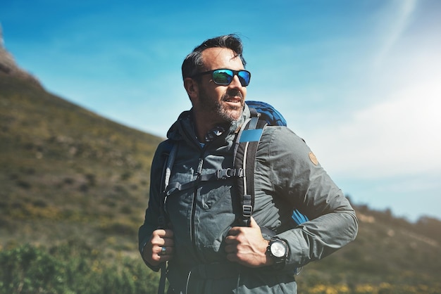 Always be proud of how far youve come Shot of a middle aged man hiking in the mountains