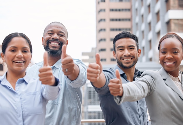 Always be proud of what you do Shot of a group of businesspeople giving the thumbs up