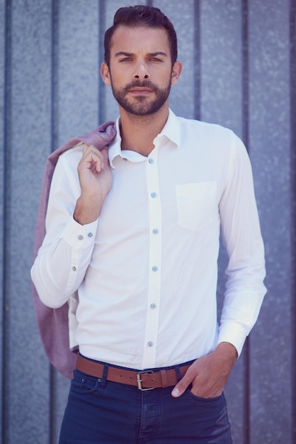 Always dress well but keep it simple Shot of a welldressed young man posing outside