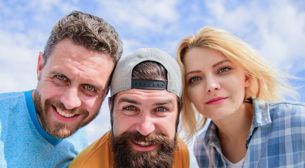 Always happy together Happy friends smile on cloudy sky Sensual woman and men happy smiling Circle of best friends Enjoying friendship relations They have friendship Group of cheerful people