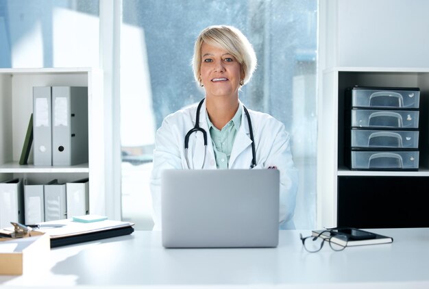 Always remember the privilege it is to be a physician. Shot of a female doctor sitting in her office.