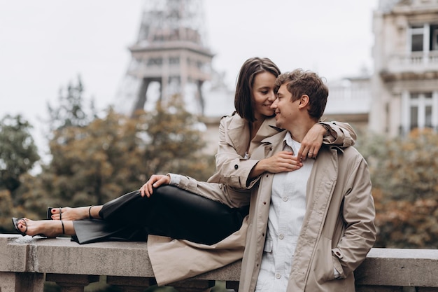 Always together Rear view of beautiful young couple bonding and looking at each other in Paris