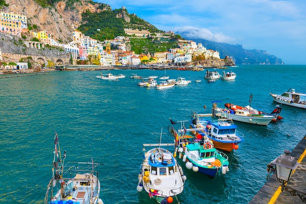 Amalfi coast Italy Beautiful view of Amalfi town and pier with fishing boats