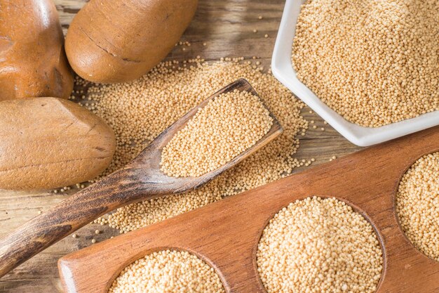 Amaranth beans in bowl on rustic wooden background