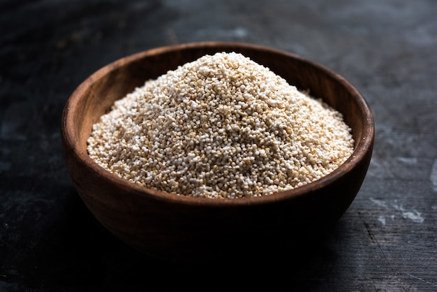 Amaranth or rajgira lahi in a bowl with sweet laddu. selective focus