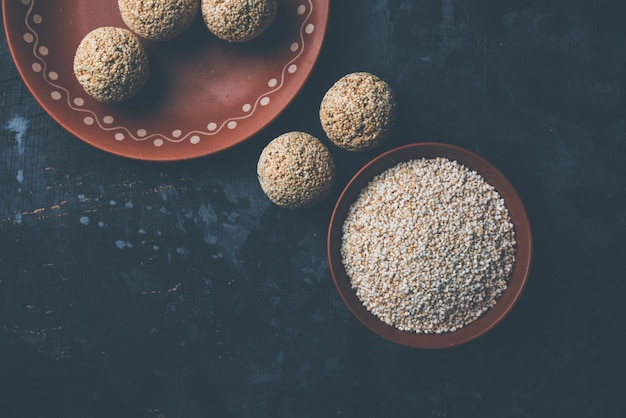 Amaranth or rajgira lahi in a bowl with sweet laddu. selective focus