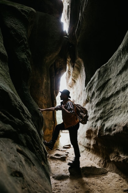 Photo amateur geologist and speleologist explores a mountain cave