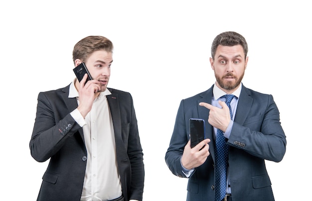 Amazed businesspeople of guy pointing finger on man talking on phone isolated on white online business