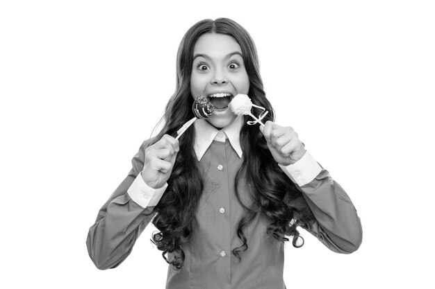 Amazed face of teen girl eat sweet chocolate candy isolated on white confectionary