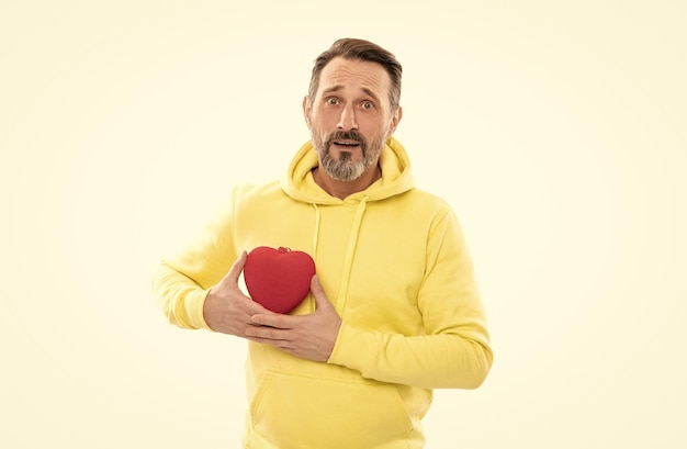 Photo amazed handsome mature man with beard and moustache in hoody hold heart shape present box symbol of love or donation isolated on white donation