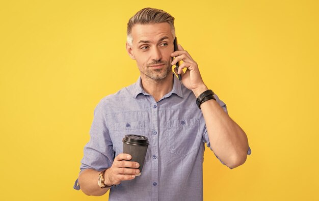 Amazed man drinking coffee modern life and lifestyle guy drink takeaway tea good morning