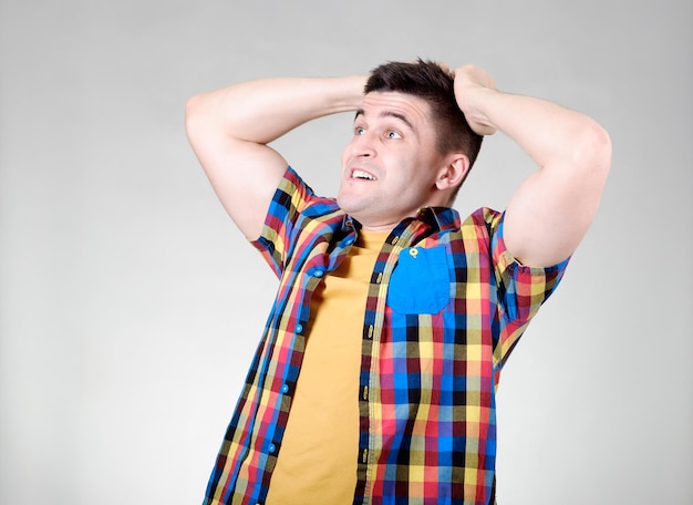 Amazed man looking left isolated