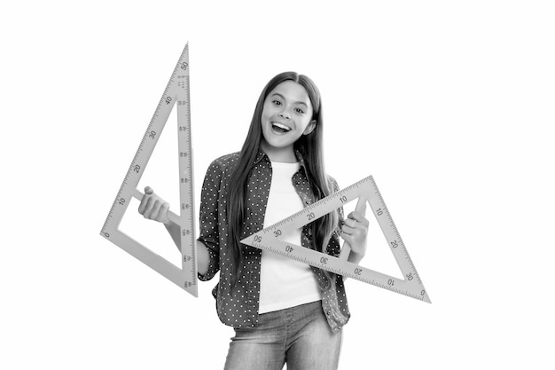 Amazed teen girl hold triangle ruler measuring angle degree at school isolated on white school