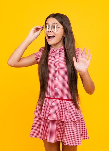 Amazed teen girl Teenager child with poor eyesight wear eyeglasses looking squinting Kids glasses Funny surprised adorable girl in round glasses having astonished shocked facial expression