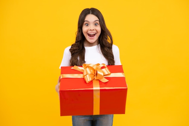 Amazed teenager teenager kid with present box teen girl giving\
birthday gift present greeting and gifting concept excited\
children