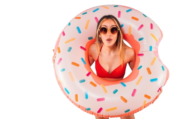 Amazed woman exits from an inflatable donut