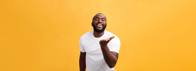 Amazed young african american hipster wearing white tshirt holding hands in surprised gesture keepin