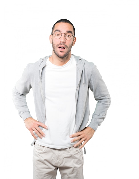 Amazed young man looking up gesture