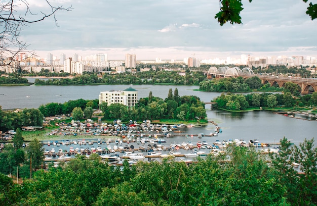 Amazing aerial drone view of the city river and bridges in Kyiv at sunset