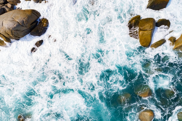 Amazing aerial view of crashing waves on rocks seascape nature view and Beautiful tropical sea with Sea coast view