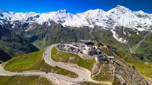 Amazing aerial view of Grossglockner mountain peaks covered by snow in summer season. Drone viewpoint over Edelweiss Spitze.