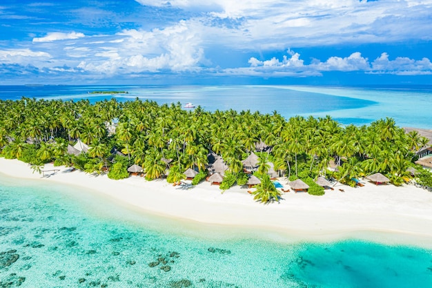 Amazing atoll and island in Maldives from aerial view. Tranquil tropical landscape and seascape