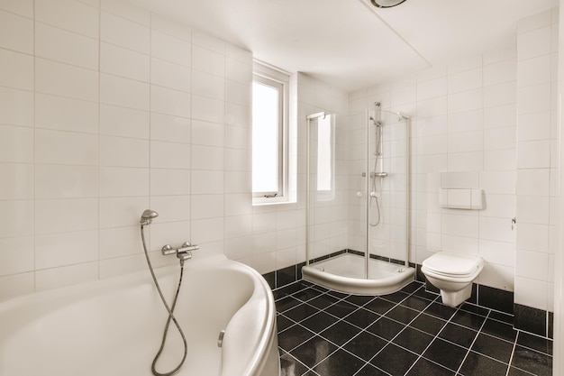 Amazing bathroom with black tiled floor