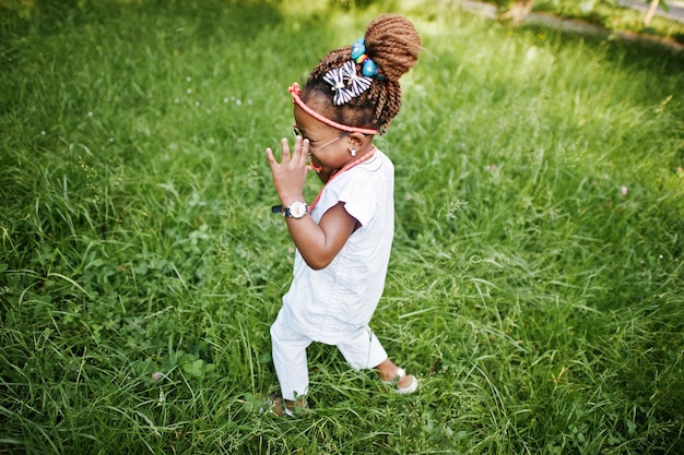 Amazing beautiful african american baby girl with sunglasses having fun