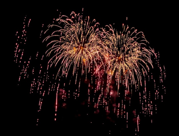 お祝い記念日メリー クリスマス イブと新年あけましておめでとうございますの黒の背景に素晴らしい美しい花火