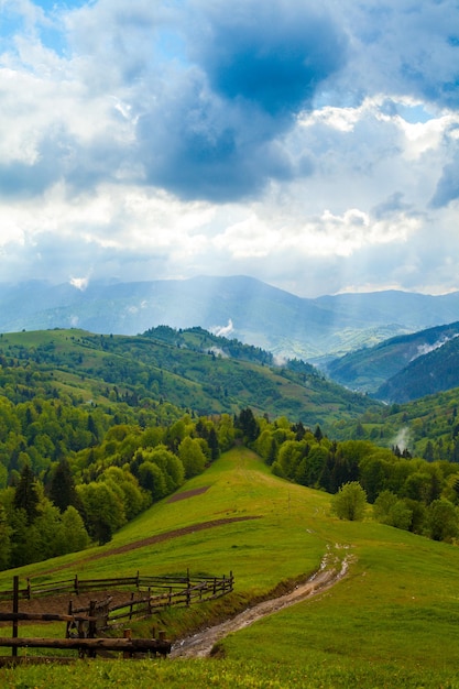 Amazing beautiful mountains with dramatical sky and clouds. View from mountain.