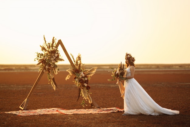 Amazing bride in sunset light. Pretty bride. Boho style