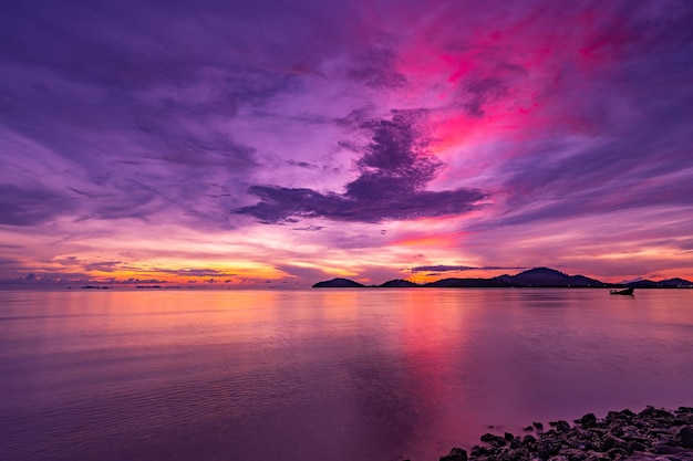 Amazing light sunset or sunrise sky over sea with wave crashing in the oceanSeascape view nature colorful sky background