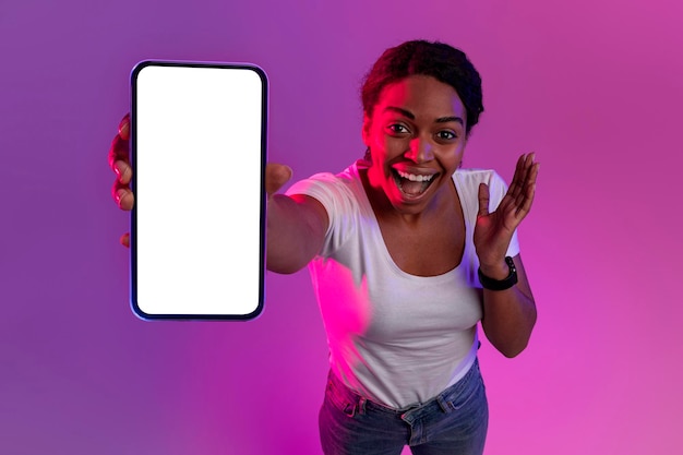 Amazing Offer Excited Black Woman Showing Blank Smartphone At Camera