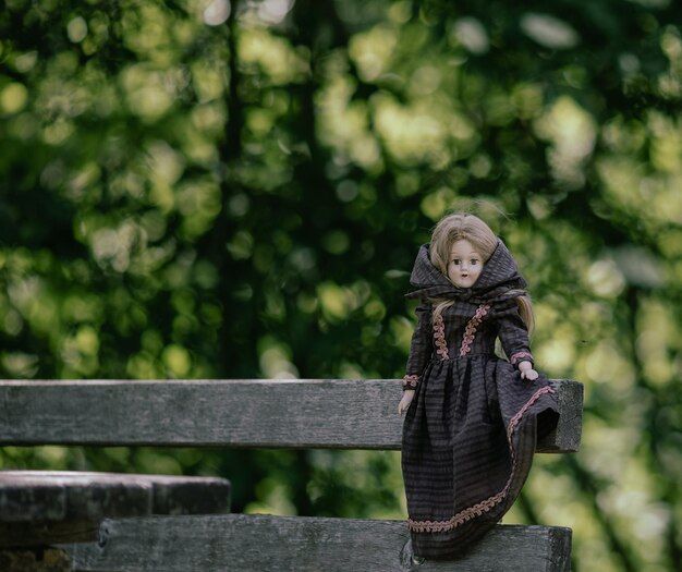 Photo amazing realistic vintage porcelain doll toy with brown eyes selective focus