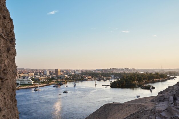 Photo amazing shoot of nile river from aswan with sail boats sailing in it