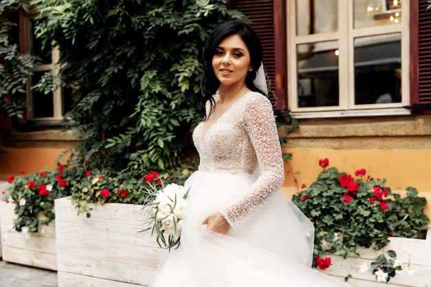 Amazing smiling wedding couple. Pretty bride and stylish groom.