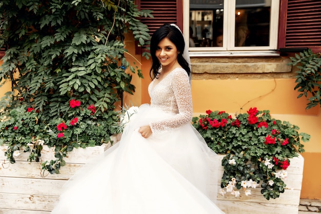 Amazing smiling wedding couple. Pretty bride and stylish groom.