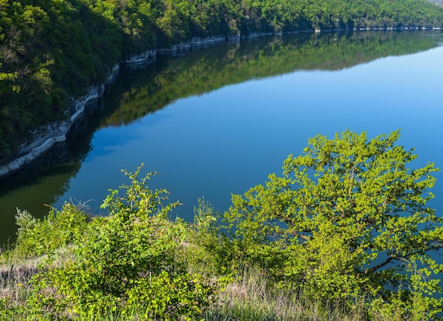 Amazing spring view on the Dnister River Canyon with picturesque rocks fields flowers This place named Shyshkovi Gorby Nahoriany Chernivtsi region Ukraine