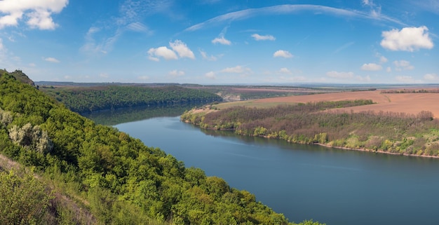 Amazing spring view on the Dnister River Canyon with picturesque rocks fields flowers This place named Shyshkovi Gorby Nahoriany Chernivtsi region Ukraine