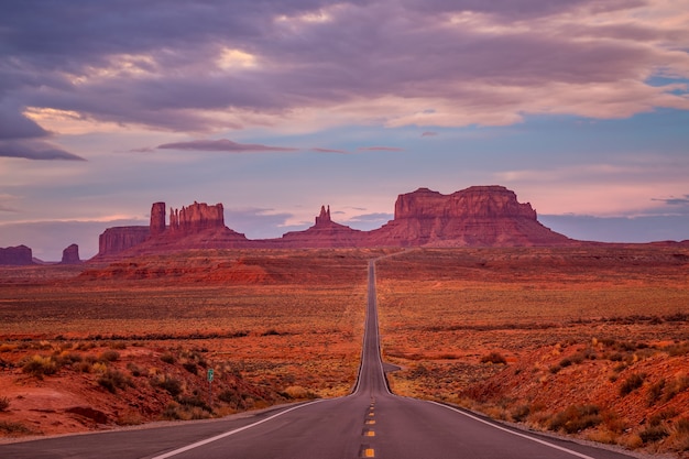 Amazing sunrise with pink, gold and magenta colors near Monument Valley, Arizona, USA.