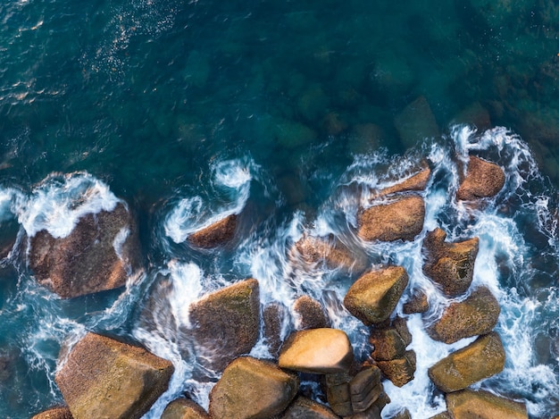 Amazing top view beautiful seashore aerial view crashing waves on rocks beautiful sea in phuket island thailand