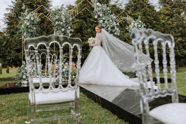 Amazing wedding bride near wedding arch Beautiful bride