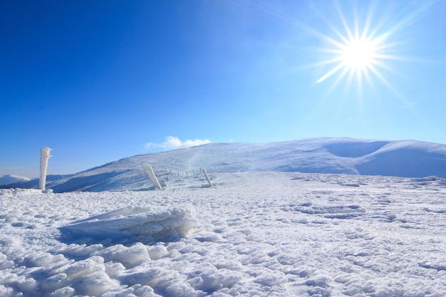 Amazing winter snowy scenery of famous and popular touristic landmark old desolate observatory on mountain Pip Ivan in Chornogora mountain ridge in Ukrainian Carpathian national park