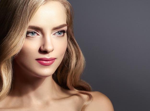 Amazing Woman Blond. Beautiful Girl studio face portrait. Studio shot.