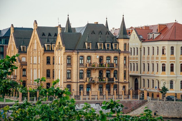 Amazing yellow old buildings on the streets of Europe on a beautiful embankment.